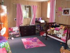  293 Albert St Maryborough QLD 4650 $269,000 5 Bedrooms 2 Kitchens and Loads of Room If your looking for a duelled residence that's close to town then you will find this home worth inspecting.  Downstairs, which is constructed from bricks, opens from a veranda with gated access and presents a large carpeted lounge, practical kitchenette, bathroom, toilet, laundry and two large bedrooms.  Ascending a lovely timber staircase the upstairs residence has three bedrooms, large open plan lounge and dining, family bathroom with separate shower, bath and separate toilet. Kitchen is all electric, dishwasher, cupboards and ample bench space. Back deck for entertaining.  Timber panelling, sash windows, fans throughout with security screen doors.  Two bay garage with lane way access, whirly birds to extract hot air, established grounds and planting. Solar hot water. Easy maintainable 539m2 block.  Priced for your consideration at $269,000neg 