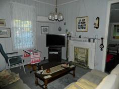 54 Railway St Helidon QLD 4344 $224,500 WALK TO THE SHOPS AND SCHOOL Great location is just one of the features of this 3 bedroom family home on a large fully-fenced block in peaceful Helidon. Enjoy the benefits of solar power, solar hot water, tank and town water and reverse cycle A/C.  Call for an inspection TODAY, this value can't last. FEATURES Bedrooms 3 Bathroom 1 Storage 6x3 Garden Shed (approx) Size 1176m2 (approx) Location Walking distance to school, shops and bus Cooling/heating 2 x Reverse Cycle A/C Parking Carport Other Solar Panels Solar hot water 2 x tanks Fully fenced Contact Scott Collier on 0423 539 872   Property Snapshot  Property Type: House Construction: Cladding Zoning: RESIDENTIAL - LOW DENSITY Land Area: 1,176 m2 Features: Dining Room Fenced Back Yard Fully Fenced Yard Garden Shed Undercover Entertainment Area Verandah 