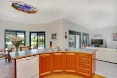  797 Yamba Rd Palmers Island NSW 2463 “Riverview” A Sense of Place, River and Awe Swing off the highway a little north of Grafton, and head towards the coastal village of Yamba. You will find this special home on the river a 10 minute drive from Yamba’s famous beaches. Tucked away off a private laneway, the home has been designed to take full advantage of the river vistas, providing the owners with the ultimate idyllic lifestyle.  The current owners are reluctant to leave the home they have created, which has served them and their family well, improving their lifestyle.  Constructed in 2000, the spacious design incorporates elements such as 11 foot ceilings and covered decks off all the living areas and bedrooms. The open plan living area is north facing, capturing the views from large sliding glass doors beyond the deck and swimming pool, over the immaculately groomed gardens to the river. A major contribution to the lifestyle factor of this home is the impressive kitchen. With solid central island workstation, large wine rack, airconditioning, gas stove, electric oven, dishwasher, double sink and range hood, all stainless steel, oak cabinetry, and practical saucepan drawers. This area extends to the dining room, which overlooks the pool and river. The addition of the leadlight ceiling feature, is reflective of the mood of the river surrounding this property.  The living areas in this home flow seamlessly out onto the covered front deck, the perfect spot to relax with friends and family on hot summer afternoons, and enjoy a BBQ or a pool party while taking in the calming views of the mighty Clarence River.  The master bedroom provides spacious walk in robe, and large ensuite bathroom with corner spa, vanity shower and loo. Two of the remaining three bedrooms, have built-in robes, and the largest fourth room would serve as a bedroom or recreational room for the family. The home is complete with double lock up remote control garage. Not only does this property provide a stylish home with all the modern comforts, there is an established clothing and embroidery business in the 9 x 6m airconditioned shed, serviced by its own shower, loo and office. An opportunity exists for the astute purchaser to utilise this approved facility to have the convenience of working from home. All equipment for the existing business is available for negotiation and the opportunity exists to build on this existing business. The current owners have stated that due to ill health they have not been able to take this business to its full potential.  There is so much more to this property, it simply must be inspected to be appreciated. A unique opportunity to purchase a beautiful home on the Clarence River, an income, an entire lifestyle all in one, this property has it all.  Contact the exclusive marketing agents, Yamba Iluka Real Estate on 6646 2400 to arrange your private viewing today. Property: 	 House Bedrooms: 	 4 Bathrooms: 	 3 Parking: 	 2 Land Size: 	 20680 Sqm Pool: 	 Yes Council: 	 Clarence Valley 