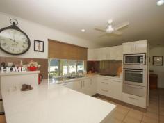 34 Thomas Ct Bulgun QLD 4854 $450,000 SPACIOUS LIVING ON LARGE BLOCK BORDERING CREEK This well presented 3 bedroom home has a lot to offer in the way of serene surroundings as well as proximity to the centre of Tully, approximately 10 minutes drive. The block is approx. 8002m2 in size. Tiled throughout and with verandahs around three sides for shade from Easterly and Westerly sun, this home has a coolness even on warm days.  The sleek, modern kitchen accomodates barstools and is a great size for those who love to cook and entertain. A viewing window through to the living room ties both spaces together and makes sure that light as well as conversation flow through to the living space. Views from the dining table are that of beautiful green rainforest foliage and distant mountain ranges. Adjacent to the kitchen, the large office space has access to the back patio.  3 bedrooms all feature built-ins with mirrored sliding doors. A vast amount of storage is offered in this home with floor-to-ceiling cupboards running the length of the hall. The bathroom offers a shower and single vanity with separate toilet adjacent. The laundry is a great feature being so large in size and boasting an internal clothesline for those grey Tully days.  The double bay remote operated roller door garage is a great asset to the property featuring a small kitchenette and a drive through roller door to the backyard as well as the ability to park 4 cars comfortably. The driveway has ample facilities for off-street parking and is well maintained, just like the gardens . The back patio has a bench and sink configuation which is currently being used for gardening purposes, but could easily serve as part of an outdoor kitchen if needed. The back yard also features a good size garden shed for all your gardening and hobby storage solutions. This house has a lot to offer and is definitely worth a look. For any enquiries do not hesitate contacting one of our friendly sales team at LJ Hooker Tully (07) 4068 1100   Property Snapshot  Property Type: House Construction: Concrete Block Zoning: RESIDENTIAL (RURAL) Land Area: 8,002 m2 Features: Built-In-Robes Established Gardens Garden Shed Outdoor Living Remote Control Garaging Renovated Security Screens Storage Undercover Entertainment Area Verandah 
