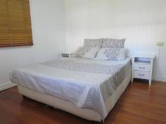  101 Pine Mountain Rd Brassall QLD 4305 379,000 2312m2 (Over half an acre) of fully fenced, shaded tree, spacious bliss located close to the CBD yet only a stroll away from shops, beauty, takeaway, IGA, bus stop, schools and all that you ever need. Be on the Warrego Highway in only a few turns of the steering wheel and when you finish with the hustle n bustle of the outside worldâ€¦come home and relax in your massive, scenic rear yard paradise! Bring the dogs, trucks, trailers, motorhome or maybe even a granny flat to plonk on this sprawling piece of Australia. The decorative front fence has just had a fresh lick of paint, as has both the internal and external areas of the home. A carport sits at the ready to park the pride and joy beneath and up to 3 small cars can easily park in under the home on the concreted slab, where you will also find the laundry area. The covered front veranda is the place to sit and watch the world pass by and inside you will find timber flooring mostly thoughout, 2 large bedrooms (1 with an adjoining sleepout area that would make a perfect ensuite/walk in robe conversion), a large air conditioned formal dining room (that would easily convert into a 3rd bedroom), an adjoining lounge room that opens into another sleepout that also extends into the supersized dining/family room that features almost a wall of beautiful stained coloured glass windows. A separate study leads out from the dining/family room area, or if you would prefer your laundry to be upstairsâ€¦then itâ€™s the place for it! The country styled kitchen is the perfect theme for the surrounding timber tongue & groove walls & ceiling, plus the decorative fretwork. A 12 month old oven takes care of business and you have plenty of room for all you need to do within the kitchen thanks to the large island bench. The bathroom definitely does the job required of it, roof insulation keeps the climate just the way you like it, high ceilings are everyone's favorite, the roof guttering has been upgraded, as has the sewer lines and storm water exit pipes. A garden shed is on hand for the lawn and garden equipment and if that needs servicingâ€¦.simply walk down to the local mower shop! Features Study Floorboards Shed Fully Fenced 