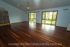  6 Outlook Cres Kuranda QLD 4881 $595,000 Almost 5 acres close to the Village House on Acreage - Property ID: 767789 This beautiful 4.7 acre property sits atop a hill at the end of a cul-de-sac and is only 5 minutes from Kuranda Village. Not far from shops and school for the kids. The property is fully fenced and is zoned rural residential so, you can keep a couple of horses or even some cows or goats. There are stables, a workshop and double shed to store feed or a vehicle. A permanent creek runs through the back boundary of this property to water the animals or even for a dip in summer! Wallabies graze on the grass and rest under the shady trees. The house is steel frame, hardy plank construction with 3 bedrooms, bathroom and ensuite off the master bedroom. There are built in wardrobes in all of the bedrooms. A recently renovated kitchen comes with a family size fridge. High ceilings, air-conditioning in the rooms and fans keep this house cool in summer. A combustion wood fired stove keeps the place warm in winter. In the afternoons you can sit on the timber deck enjoying a drink and the beautiful views of the rainforest on your property.  There is a small office, from which you could run your own business. A double carport is at the entrance to the house.  Solar panels have been installed on the roof and feed back to the grid. The Inverter is 5 kw The 26 panels are 6.5 Kw for extra performance It at times produces 35+ Kwh in a day Acreage properties close to town like this rarely come up for sale in Kuranda, so get in quick!  Print Brochure Email Alerts Features  Land Size Approx. - 1.76 hectares  4.7 acres  close to Kuranda VIllage  solar panels  permanent creek  mountain views  3 bedrooms 