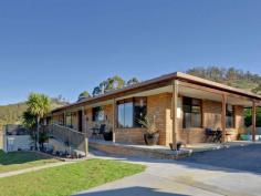  595 Native Corners Rd Campania TAS 7026 $365,000+ Charming Country Living With winter on the way, are you looking for a cosy country home where you can snuggle in front of the fire? You'll love coming home to your own sweet rural retreat. Only 35 minutes from Hobart and set on about 5 1/2 acres of low maintenance cleared land, this lovingly maintained home is perfect for the homebuyer who longs to get away from it all without breaking the budget. This home has a welcoming feel to it that makes you want to linger. Upon entering, you'll notice the wood heater in the lounge has been placed against an inside wall, ensuring it heats the whole house. Attractive windowed doors with decorative glass can be closed to separate the two living areas. The main lounge window looks out onto the nearby hills and valleys that are so flawless it is like having a beautiful painting on your wall. The kitchen inspires visions of home cooked meals, mouth-watering casseroles and roasts. There is lots of pantry space and a kitchen island for extra bench space. A bay window in the generous dining area adds charm and gives a resplendent view of the hills and yard, complete with adorable gazebo, swaddled in fragrant geranium.  Toward the back of the house is the bathroom and with its deep tub and decorative glass window you are sure to be enticed into many a relaxing bubble bath. The laundry is practical and functional with good cupboard space. Surprisingly spacious yet still having an intimate feel, this home has been cleverly designed to have separation between the master bedroom and the other sleeping quarters, ideal for families who appreciate their own space and privacy. Two cosy bedrooms are at one end of the hall and get good sun. Both have built in robes. The inviting master bedroom at the far end of the hall is much larger and has a sizeable built in robe plus views from the generously size window. You can lie in bed and take in the scenery upon waking. The property also has a large colourbond workshop/garage, raised garden beds out the back for growing your own vegies, a garden shed plus three huge water tanks. Further up the hill is a barn/woodshed. To complete this idyllic country home, a covered Verandah runs all the way around the house, with a deck placed off the second living area. This area is perfect for outdoor entertaining with friends on warm summer evenings or a place to cosy up with a loved one, share a bottle of wine and marvel at the stars. Underneath the deck is a storage area.  By the way, this house with its sunny aspect and inviting feel will draw all your friends in and it is likely you will have friends and family dropping by all the time.  It's just that kind of place. Call Aaron or Helen now to secure your private inspection time.   Property Snapshot  Property Type: House Aspect Views: Mountain Construction: Brick House Size: 147.00 m2 Land Area: 5.50 acres Features: Built-In-Robes Decking Gazebo Heatpump Rumpus Room 