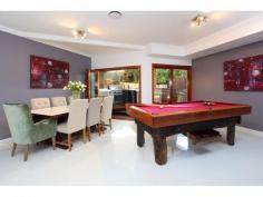  3 Mercury Ct Bridgeman Downs QLD 4035 Offers Over $1,295,000 A Grand Design With Elegance Property ID 1304781 Located in Central Bridgeman Downs in a secluded street opposite bushland and close to parks, walking and biking tracks, you will find what can only be described as a true one off home. The attention to detail in this home is superb in every respect. This is a home of significant proportions, set gloriously behind high walls with an impressive entrance and gate house assuring security, yet boasting an entrance to the home evoking a welcoming feel. Solid Double Timber doors open to a fully tiled foyer where your journey of discovery truly begins. The home has recently undergone significant expansions and remodeling in keeping with the tasteful elegance portrayed throughout the home. The lower level is designed for living, with multiple areas of separation for the whole family. There is a formal lounge and formal dining, a dedicated and impressive theatre room, huge family and meals area adjacent the most superb chefs kitchen catering for every possible dining genre. No detail has been left out, with quality 2 pak cabinetry,island style breakfast bar, stone benchtops, and appliances of the highest quality, stainless steel and integrated superbly into the space creating a kitchen a masterchef would be proud to create in. There has also been created a servery window direct to the outdoor lounge area Adjacent and accessible from multiple rooms through timber and glass foldback doors is the massive and impressive roofed outdoor entertaining and dining precinct. This magnificent timber decked area has been thoughtfully created to ensure relaxation, entertaining and dining are all pursuits enjoyed to the full. The outdoor kitchen and barbecue area blend effortlessly with the lounge and dining space which overlook the delightful inground saltwater pool surrounded by glass balastrading. The pool area is surrounded by tiered decking and provides a variety of sitting and relaxing options around the pool. Upstairs the journey continues with access via a timber and glass staircase situated adjacent the foyer. here we find bedrooms 2,3 and 4 wrapped around the family bathroom superbly stylish in every respect with double ceramic vanities, stone tops, frameless shower and generous bath. The Master Suite located at the opposite end of this floor is an oasis of style, luxury and space. The recreated area has been enlarged significantly and provides all that a couple would need and desire in a pampering environment. With own lounge and kitchenette, TV area and superbly fitted out walk in robe, this is a delightful way to unwind from life's hectic pathway. The Master suite is a 5 star hotel standard with an ensuite that is truly in keeping with the magnificence of the home. Floor to ceiling tiles, double ceramic vanities, corner spa bath, double shower and plantation shutters, no detail has been overlooked. In addition the home boasts ducted zoned air conditioning to both levels, security cameras and intercom, security grilles and doors throughout, 4 car automated garaging, solar power and water tanks and excellence to detail in every respect. This is a home that commands your immediate attention if quality and space are high on your agenda. Close to both public and private schools, public transport and minutes to Westfield Chermside with its plethora of retail, entertainment and dining options The many attributes of this superb home are many, and far more than space allows.  Upper Level 1 Master Bedroom with ensuite, parents retreat, WIR  3 Bedrooms, built-ins Family bathroom Study Lower level 5th Bedroom, built-ins Formal dining Living room Study Family room Stunning kitchen with stone top benches Family bathroom Media room Gym Huge Entertaining deck with outdoor kitchen Store room Swimming pool Double car garage Fully Fenced 920m2 Walking tracks nearby Walking distance public transport 