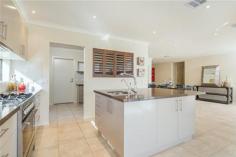  73-75 Westlakes Boulevard Lara VIC 3212 $729,000 - $759,000 Your Grand lifestyle awaits you 4 3 2 Three words come to mind when viewing this 4 Bedroom home," Impressive, Impeccable and Stylish" yet it is a carefully thought out residence that combines the impressive with practical functionality. The design flows effortlessly both inside and out with zoned heating and cooling allowing for comfort throughout the seasons. Taking pride of place on the lake front in the established Grandlakes estate, the property boasts excellent side access for those extra cars, boats and toys and an abundance of extra features from the several living zones facing out to the views to the spectacular kitchen which is a masterpiece in itself with its flowing stone bench tops, large island bench, s/s appliances and an exquisite butler’s pantry. There are two master bedrooms with one being downstairs with its own ensuite and WIR whilst upstairs there are a further 3 BRs all large with the master suite including the fitted out generous WIR, ensuite and parents retreat. There is a large rumpus/ games room with fantastic views to the lake and parklands which has access to the fabulous tiled entertainment sized balcony perfect for those balmy evenings. Other striking features of the home include fresh neutral tones, alarm system, quality window and floor coverings, a multitude of storage cupboards, landscaped gardens and more. This is a home one must see to appreciate so call today to book your inspection. 