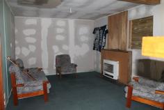 60-62 Esplanade Queenstown TAS 7467 $35,000 Property Information Cottage on two blocks. Just what the renovator is looking for. Some of the hard work is done. Lounge has pure heat wall heater for warmth while renovating. Kitchen complete with stove. Bathroom has been renovated with tiled floor, new shower, vanity and ceiling heating. New toilet. Some of the new cladding has been done but plenty of scope to add your own touch. Great workshop with character which will come in handy for storing tools for the renovation. Spare block of 376sqm for gardens or chooks. With some hard work you could own your very own. Call to discuss further or to organise inspection. Land Size 	 610 sqm Property condition 	 Renovator Property Type 	 House House style 	 Cottage Garaging / carparking 	 Off street Construction 	 Timber and Cladding Joinery 	 Timber Roof 	 Iron Walls / Interior 	 Panel sheeting Flooring 	 Carpet, Other (Vinyl) and Timber Window coverings 	 Drapes Heating / Cooling 	 Electric Chattels remaining 	 Fixed floor coverings, Light fittings, Stove, Curtains Kitchen 	 Original and Upright stove Living area 	 Separate living, Separate dining Main bedroom 	 Double Bedroom 2 	 Double Main bathroom 	 Separate shower, Heater Laundry 	 Separate Workshop 	 Separate Views 	 Urban Fencing 	 Partial Land contour 	 Flat Grounds 	 Overgrown Water heating 	 Electric Water supply 	 Town supply Sewerage 	 Mains Locality 	 Close to shops, Close to schools 