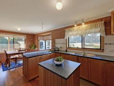  595 Native Corners Rd Campania TAS 7026 $365,000+ Charming Country Living With winter on the way, are you looking for a cosy country home where you can snuggle in front of the fire? You'll love coming home to your own sweet rural retreat. Only 35 minutes from Hobart and set on about 5 1/2 acres of low maintenance cleared land, this lovingly maintained home is perfect for the homebuyer who longs to get away from it all without breaking the budget. This home has a welcoming feel to it that makes you want to linger. Upon entering, you'll notice the wood heater in the lounge has been placed against an inside wall, ensuring it heats the whole house. Attractive windowed doors with decorative glass can be closed to separate the two living areas. The main lounge window looks out onto the nearby hills and valleys that are so flawless it is like having a beautiful painting on your wall. The kitchen inspires visions of home cooked meals, mouth-watering casseroles and roasts. There is lots of pantry space and a kitchen island for extra bench space. A bay window in the generous dining area adds charm and gives a resplendent view of the hills and yard, complete with adorable gazebo, swaddled in fragrant geranium.  Toward the back of the house is the bathroom and with its deep tub and decorative glass window you are sure to be enticed into many a relaxing bubble bath. The laundry is practical and functional with good cupboard space. Surprisingly spacious yet still having an intimate feel, this home has been cleverly designed to have separation between the master bedroom and the other sleeping quarters, ideal for families who appreciate their own space and privacy. Two cosy bedrooms are at one end of the hall and get good sun. Both have built in robes. The inviting master bedroom at the far end of the hall is much larger and has a sizeable built in robe plus views from the generously size window. You can lie in bed and take in the scenery upon waking. The property also has a large colourbond workshop/garage, raised garden beds out the back for growing your own vegies, a garden shed plus three huge water tanks. Further up the hill is a barn/woodshed. To complete this idyllic country home, a covered Verandah runs all the way around the house, with a deck placed off the second living area. This area is perfect for outdoor entertaining with friends on warm summer evenings or a place to cosy up with a loved one, share a bottle of wine and marvel at the stars. Underneath the deck is a storage area.  By the way, this house with its sunny aspect and inviting feel will draw all your friends in and it is likely you will have friends and family dropping by all the time.  It's just that kind of place. Call Aaron or Helen now to secure your private inspection time.   Property Snapshot  Property Type: House Aspect Views: Mountain Construction: Brick House Size: 147.00 m2 Land Area: 5.50 acres Features: Built-In-Robes Decking Gazebo Heatpump Rumpus Room 