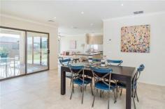  73-75 Westlakes Boulevard Lara VIC 3212 $729,000 - $759,000 Your Grand lifestyle awaits you 4 3 2 Three words come to mind when viewing this 4 Bedroom home," Impressive, Impeccable and Stylish" yet it is a carefully thought out residence that combines the impressive with practical functionality. The design flows effortlessly both inside and out with zoned heating and cooling allowing for comfort throughout the seasons. Taking pride of place on the lake front in the established Grandlakes estate, the property boasts excellent side access for those extra cars, boats and toys and an abundance of extra features from the several living zones facing out to the views to the spectacular kitchen which is a masterpiece in itself with its flowing stone bench tops, large island bench, s/s appliances and an exquisite butler’s pantry. There are two master bedrooms with one being downstairs with its own ensuite and WIR whilst upstairs there are a further 3 BRs all large with the master suite including the fitted out generous WIR, ensuite and parents retreat. There is a large rumpus/ games room with fantastic views to the lake and parklands which has access to the fabulous tiled entertainment sized balcony perfect for those balmy evenings. Other striking features of the home include fresh neutral tones, alarm system, quality window and floor coverings, a multitude of storage cupboards, landscaped gardens and more. This is a home one must see to appreciate so call today to book your inspection. 