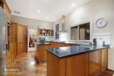  103 Aberdeen St Newtown VIC 3220 $1,190,000 - $1,290,000 Property Information This home is sure to impress with its handsome modern style blending with beautiful old world features. Tightly held in one family for over 20 years this home is one that you will fall in love with the moment you open the private front gate. Set in a prestigious location within walking distance to first class schools, the Geelong CDB, Pakington Street and set on a huge 849m2 with rear lane access makes this home ideal for families. From the front garden you are presented with classic Edwardian facade of the early 1900's perfectly framed with luscious gardens and mature trees. Once you step in the front gate you really feel like you could be miles away from the hustle and bustle.  The home is elegant in every way with high ceilings, decorated cornices, stunning lighting, timber fretwork, double hung windows, high skirting boards and original lead lighting throughout. This home has been extended and renovated to suit the modern family and offers a well designed floor plan to suit younger children or teenagers. The main bedroom is spacious with walk in robe, huge recently renovated ensuite with gleaming large tiles, spa bath and clear framed shower. The 2nd bedroom is oversized with a beautiful outlook of the leafy garden through the bay window. Further 2 bedrooms are also oversized with built in robes.  Delightful warm living areas invite family entertaining for a large number of guests, offering a lovely setting overlooking the pool and large paved courtyard. The kitchen is well positioned in the centre of the home with huge granite benches, double wall oven, 900mm stainless steel cooktop with canopy range hood, display cupboards and island bench. Separate formal dining room entices and commands admiration with stunning bay window and chandelier. The rumpus room is quite separate from the other rooms, is big enough for a lounge suite, billiard table and has huge double doors straight out to the swimming pool and also offers a brand new ensuite for quick trips to the bathroom for your guests and to use from the pool.  Every day is a holiday with a tranquil pool (fully automated & solar heated) that completely beautifies the grounds as well as making the huge piece of land quite easy to manage. With paving all around the yard and lovely leafy gardens to make you feel like you are in a resort somewhere, this home really does make you want to relax and enjoy the day. Many other features including evaporative cooling, hydronic heating, log fire, crimsafe security screens/doors, alarm system, fully automatic watering system, new laundry with loads of storage, great sized study with built in storage, double garage with remote, internal access, rear lane access all on a huge and extremely rare 849m2. This home is a property you must inspect to truly grasp the grand style of what is on offer. Call Donna now to book your private inspection before this home is gone. Land Size 	 849 sqm Property Type 	 House 