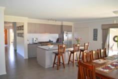  59 Skuses Rd Allansford VIC 3277  $599,000 City living in the Country Consider this very well presented 3 year old home on a quiet country road, it has expansive district views and everything a new family home offers. Comprising 4 bedrooms plus study, master with ensuite and WIR, central bathroom (separate bath and shower) and large laundry. The open plan living area features a well equipped kitchen with large walk in pantry, gas cook top, electric oven, dishwasher and breakfast bar, light filled dining area and living space. There is a second living room which is ideally set up for a parents retreat. Quality is evident throughout the home including tiled flooring in the traffic areas and carpet through the quiet areas. Ducted central heating, reverse cycle air conditioning and 3.5 kw solar power are an added feature. The double garage has an auto door and direct access to the home. A north facing sheltered patio, presents as a third living space ideal for entertaining and enjoying the large garden . The approx. 5 acres are subdivided into 3 well fenced paddocks protected by cypress plantations. A 10m x 7m colourbond shed comes with a mezzanine for extra storage. Water is never a problem, with 2 x 22,500 litre rain water tanks backed up with a bore & 22,500 litre tank. If you are looking for a quality lifestyle property away from the hustle and bustle but close enough to town, this property is well worth an inspection Price For Sale $599,000 Category House 