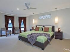  35 The Pkwy Pakenham VIC 3810 $420,000 Sun Drenched Family Home – Lakeside Inspection Times: Sat 04/07/2015 12:30 PM to 01:00 PM Relax, entertain or play, it's all here...  Be quick to view this outstanding family focussed home in the prestigious Lakeside estate. Sitting proudly on this 600SQM approx block is this enchanting 4 bedroom home offering 27SQ's approx (URL) and plenty of space for all to enjoy.  The country style street appeal is only enhanced with a front verandah and plantation shutters. The welcoming entrance forms part of the 7.0m x 4.7m front living room, ideal for all your family entertainment needs. The second living space is open plan so also offers a dining area and large kitchen. Appliances include a dishwasher, under bench oven and gas cook top, with plenty of cupboards and a walk in pantry to satisfy your storage needs. This naturally light filled part of the home then leads seamlessly outside to the main verandah, gardens and play area featuring a sandpit and swings.  The master bedroom is just that, spacious, sunny and inviting with a WIR and ensuite, a sanctuary you won't want to leave. The second bedroom also features a WIR making it perfect for a teenager, while the third has a freestanding robe and the fourth a BIR.  The long list of extras includes a double remote garage with rear roller door, GDH, Evaporative cooling, energy saving LED lighting throughout, a small shed and a programmable irrigation system for easy garden maintenance.  A true family home to be enjoyed so don't miss out! 