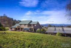  26 Hopetoun Rd Dover TAS 7117 $490,000 Property Information Situated on 5 acres of level to sloping pasture this Large 4 plus bedroom brick home has been built with a solid brick structure and features some of the most amazing fit outs of natural minor species Tasmanian timbers and enough sheds to satisfy even the largest of collectors or home business operators. Views reach over the surrounding farm land out to the bay and islands of Port Esperance which can be seen from almost every room in the house. The property features around 300m2 of shed space ranging from garages, open machinery sheds, workshops and more. The property has been extensively landscaped around the home offering a large rear outdoor entertaining area and easy care gardens. There is a large dam sufficient for a property of much larger magnitude where you can draw as much garden water as you will ever desire along with plenty of tank water catchment from the extensive covered roof areas.  Downstairs the living areas are split level and semi open plan and has access to the entertaining areas. The magnificent timber work includes Tasmanian Blackwood internal doors and kitchen doors, Feature paneling and inserts in most rooms that feature, Celery Top Pine, Myrtle and King Billy Pine that are a testament to the quality fit out and investment that has been made into this home when it was built in 1993. To see more of this amazing property please email or call anytime to arrange a private inspection. Floor Area 	 212 sqm Land Size 	 2.06 Ha Tenure 	 Freehold Property condition 	 Excellent Property Type 	 House Garaging / carparking 	 Many Garages, Double lock-up, Single lock-up, Open carport Construction 	 Brick veneer and Brick Joinery 	 Aluminium Roof 	 Colour bond Walls / Interior 	 Gyprock, Brick, Timber Flooring 	 Carpet, Other (Vynil), Polished, Timber and Parquetry Window coverings 	 Drapes, Blinds Heating / Cooling 	 Woodfire (Closed) Chattels remaining 	 Blinds, Drapes, Fixed floor coverings, Light fittings, Stove, Curtains Kitchen 	 Separate cooktop, Separate oven, Rangehood, Double sink, Breakfast bar, Pantry and Finished in Timber and Laminate Living area 	 Formal dining, Separate dining, Open plan Main bedroom 	 Double and Walk-in-robe Ensuite 	 Separate shower, Spa bath Bedroom 2 	 Double and Built-in / wardrobe Bedroom 3 	 Double and Built-in / wardrobe Bedroom 4 	 Double and Built-in / wardrobe Additional rooms 	 Attic, Conservatory / sunroom, Office / study Main bathroom 	 Separate shower Laundry 	 Separate Workshop 	 Combined, Separate Views 	 Bush, Water, Rural Aspect 	 East Outdoor living 	 Entertainment area (Uncovered, Paved and Concrete), BBQ area Fencing 	 Partial, Materials (Post & Wire and Timber) Land contour 	 Flat to sloping Grounds 	 Landscaped / designer Garden 	 Garden shed (Sizes: Refer to plans, Number of sheds: 4) Water heating 	 Electric Water supply 	 Tank (size: 50,000lt) Sewerage 	 Septic Locality 	 Close to shops, Close to schools 