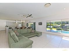  21 Ridge Pl Redland Bay QLD 4165 999,000+ Dual Living…Ultimate 2 Family Lifestyle!! On a private 1/2 acre in Redland Bay, Electric gates roll back to reveal this sprawling 55 + square residence offering a family friendly design with an emphasis on style and quality. An ideal home for one big family or two, this fantastic floor-plan provides options galore..  * 	 4 Living areas; Including 2 large & separate lounge areas, family rumpus & genuine media room.  * 	 6 Spacious bedrooms; Including 3 master suites, and 4 bathrooms.  * 	 2 Kitchens; Both boast luxury finish with stone bench-tops & stainless appliances.  * 	 Stunning resort style pool; Complete with party cabana.  * 	 Super large outdoor entertaining area, central to both dwellings.  * 	 Tropical low-maintenance grounds boasting large grassy areas ideal for a bit of backyard footy or cricket.  * 	 6 car garaging; Including 4 car house garaging, plus separate shed with 3 phase power!  * 	 Add to this 9ft ceilings, ducted air-conditioning, intercom & video security, solar electricity, water tanks, and fully fenced with electric entrance gate.  Custom built to the highest standard, this unique property is literally 'one of a kind' and offers something very special for buyers looking to purchase a Dual Living masterpiece. PROPERTY DETAILS 999,000+ ID: 328255 Land Area: 2000 m² 