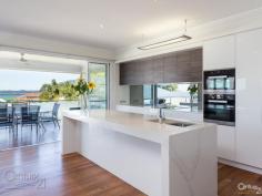  9 Waterfront Pl Redland Bay QLD 4165 $899,000 The perfect family entertainer, sweeping water views Level 1  * 	 4 double sized bedrooms with built ins  * 	 All purpose built in study or library  * 	 Large lounge room with wet bar and storage.  * 	 Saltwater swimming pool with glass fences and BBQ kitchen.  * 	 Established gardens, private grassed front yard with water views.  * 	 Secure side access to carport with 2 garden sheds plus water tank.  * 	 Remote double garage plus secure carport.  Level 2  * 	 Impressive master suite, walk in robe and bathroom.  * 	 Open plan living and dining with sweeping ocean views.  * 	 New contemporary kitchen with Meile appliances opening onto a large covered alfresco deck overlooking the Bay.  * 	 Powder room, security system and vacuum-maid.  This beautiful property turns 8 this year, has direct bay breezes, features 9 foot ceilings, ceiling fans, extra parking for a boat or trailer, night lighting in the pool, and sits perfectly in a Cul de sac.  Inspections by appointment only. PROPERTY DETAILS Offers Over $899,000 ID: 331343 Land Area: 807 m² 