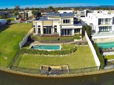  136 Sir Bruce Small Blvd Benowa QLD 4217 Auction This Saturday Onsite 3pm NORTH FACING DESIGNER HOME ON PANORAMIC WIDE WATER OWNERS HAVE BOUGHT ELSEWHERE - MOTIVATED SELLERS! A stunning modern residence with quality and stylish inclusions, this residence turns heads based on appearance and functionality alone. Add the north facing lakefront position and exclusive street address to its resume, and it becomes impossible to overlook. Designed with multiple generous living and entertaining spaces, both indoor and out, this two storey abode offers a lifestyle of sophistication and style. The impressive island kitchen showcases granite bench tops, gourmet stainless steel SMEG appliances and soft-close drawers. This beautiful home presents versatile indoor spaces, including three open plan living areas plus dining, all encapsulated under soaring voids and high ceilings, creating a wonderful sense of space. Clever positioning of windows allows for magnificent water and skyline views gracefully set behind the waterfront outdoor entertaining deck and sandstone sparkling in-ground swimming pool. The king-sized master bedroom includes a luxurious spa ensuite, large walk-in wardrobe, direct balcony access and serene water views. The remaining bedrooms are double sized, with the guest bedroom inclusive of a separate entrance and powder room allowing the option of using it as a home office. Additional features include; built-in zoned surround sound system, designer bathrooms, secure remote garaging for two cars, intercom, ducted air-conditioning, security screens, laundry, immaculate condition, and low maintenance gardens. Located on the most sought-after street in Benowa Waters, only minutes to Benowa Shopping Centre, Botanic Gardens, Pindara Private Hospital, exclusive schools, and an abundance of boutique cafes and restaurants, this elegant home affords the complete lifestyle. *Two storey modern designer home on 860sqm north facing lakefront position *Entertaining deck with panoramic views of Surfers Paradise skyline and hinterland *Gourmet granite island kitchen with quality SMEG appliances, soft close drawers *Five bedrooms, guest room could be an office with separate entry and powder room *King sized master bedroom with luxury spa ensuite, walk-in wardrobe and views *Multiple open plan living and dining areas, built-in zoned surround sound system *Ducted air-conditioning, intercom, laundry, swimming pool, manicured gardens *Double automatic garage, high-ceilings, designer bathrooms, quality fittings *Sought-after peaceful street, close to shops, schools, cafes and restaurants For further information or to arrange an inspection please contact Sam Guo or Julia Kuo. Disclaimer: This property is being sold by auction or without a price and therefore a price guide cannot be provided. The website may have filtered the property into a price bracket for website functionality purposes. We have in preparing this information used our best endeavours to ensure that the information contained herein is true and accurate, but accept no responsibility and disclaim all liability in respect of any errors, omissions, inaccuracies or misstatements that may occur. Prospective purchasers should make their own enquiries to verify the information contained herein. * denotes approximate measurements 