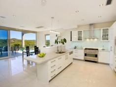  36 Gurney Cres Seaforth NSW 2092 $11,000,000 The Ultimate Harbourside Mansion This incredibly substantial and architecturally designed master built mansion and has been designed with extreme comfort, premium quality and luxury in mind while privately nestled amongst the trees on a double lot. Prominently positioned with almost 1000m2 of luxurious modern living across three levels. It is unsurpassed in design, quality and location. The beautiful surroundings are further embraced with 20-metre wide terraces on each of the three levels. The home offers spectacular 210-degree panoramic views of Middle Harbour from every level. The tranquil views of untouched waterfront reserves, secluded harbours and endless pristine blue waters create the impression that you are living in a private paradise, while being only 30 minutes from Sydney CBD, and just moments from Seaforth shops, restaurants, schools, parks, golf courses, and transport to the city and the popular northern beaches. - 2 Gourmet kitchens & one Kitchenette - Entertainment room and home theatre with home-wide audio system - Heated flooring, double sided gas fireplace - Fully approved three bedroom guest house - separate accommodation - Specially designed home gymnasium - Wine cellar - holding 1200+ bottles - C-Bus system with colour touch screen - Fully integrated security system with infra-red cameras - Sauna fully imported from Finland - Eco friendly BASIX Certified home - Glamorous infinity gas heated 11 metre wet edge pool with Jacuzzi and two spas - Koi fishponds, water features, landscaped grounds - Boat moorings and a fenced public sea pool in a waterfront reserve - Two street access Inspect by Appointment - Mark Clarke 0407 600 211 