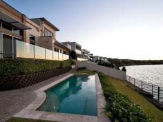  136 Sir Bruce Small Blvd Benowa QLD 4217 Auction This Saturday Onsite 3pm NORTH FACING DESIGNER HOME ON PANORAMIC WIDE WATER OWNERS HAVE BOUGHT ELSEWHERE - MOTIVATED SELLERS! A stunning modern residence with quality and stylish inclusions, this residence turns heads based on appearance and functionality alone. Add the north facing lakefront position and exclusive street address to its resume, and it becomes impossible to overlook. Designed with multiple generous living and entertaining spaces, both indoor and out, this two storey abode offers a lifestyle of sophistication and style. The impressive island kitchen showcases granite bench tops, gourmet stainless steel SMEG appliances and soft-close drawers. This beautiful home presents versatile indoor spaces, including three open plan living areas plus dining, all encapsulated under soaring voids and high ceilings, creating a wonderful sense of space. Clever positioning of windows allows for magnificent water and skyline views gracefully set behind the waterfront outdoor entertaining deck and sandstone sparkling in-ground swimming pool. The king-sized master bedroom includes a luxurious spa ensuite, large walk-in wardrobe, direct balcony access and serene water views. The remaining bedrooms are double sized, with the guest bedroom inclusive of a separate entrance and powder room allowing the option of using it as a home office. Additional features include; built-in zoned surround sound system, designer bathrooms, secure remote garaging for two cars, intercom, ducted air-conditioning, security screens, laundry, immaculate condition, and low maintenance gardens. Located on the most sought-after street in Benowa Waters, only minutes to Benowa Shopping Centre, Botanic Gardens, Pindara Private Hospital, exclusive schools, and an abundance of boutique cafes and restaurants, this elegant home affords the complete lifestyle. *Two storey modern designer home on 860sqm north facing lakefront position *Entertaining deck with panoramic views of Surfers Paradise skyline and hinterland *Gourmet granite island kitchen with quality SMEG appliances, soft close drawers *Five bedrooms, guest room could be an office with separate entry and powder room *King sized master bedroom with luxury spa ensuite, walk-in wardrobe and views *Multiple open plan living and dining areas, built-in zoned surround sound system *Ducted air-conditioning, intercom, laundry, swimming pool, manicured gardens *Double automatic garage, high-ceilings, designer bathrooms, quality fittings *Sought-after peaceful street, close to shops, schools, cafes and restaurants For further information or to arrange an inspection please contact Sam Guo or Julia Kuo. Disclaimer: This property is being sold by auction or without a price and therefore a price guide cannot be provided. The website may have filtered the property into a price bracket for website functionality purposes. We have in preparing this information used our best endeavours to ensure that the information contained herein is true and accurate, but accept no responsibility and disclaim all liability in respect of any errors, omissions, inaccuracies or misstatements that may occur. Prospective purchasers should make their own enquiries to verify the information contained herein. * denotes approximate measurements 