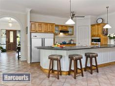 16 Wollundry Pl The Gap QLD 4061 $900,000 Proudly situated on 1000sqm at the end of a quiet cul-de-sac, offering peace and tranquillity high up among the treetops, sits this magnificent family home that commands attention and brings you back to nature. With views across to Mt Coot-tha and the D'Aguilar National Park from the wrap-around deck, this home strikes the perfect balance between the relaxed peacefulness of its setting and the convenience of living close to all local amenities. This home offers fantastic flexibility, with a fully self-contained granny flat on the lower level, which could be utilised as the perfect space for family or guests, a retreat for teenagers or even the opportunity for passive income should you wish to rent it out. You will love entertaining on your large rear deck, listening to the waterfall trickle into the fishpond and the call of the abundant local bird life. Situated in the Hilder Road State school catchment area and in close proximity to Mt St Michael's and Marist Brothers Ashgrove secondary colleges, this terrific family home offers the following features: Upstairs Master bedroom: King-sized, with air-conditioning, large walk-in robe and huge ensuite with recessed bath Bed 2: Double, with built-in-robe and amazing views Bed 3: Single, with built-in robe, ceiling fan and lovely views Bed 4: Currently configured as a Study  Formal lounge room with huge banks of bookcases and French doors opening on to the wrap-around deck which showcase stunning views Kitchen with dishwasher, pantry, electric cook top, convection oven, breakfast bar and double sink Large air-conditioned open-plan family living area and dining area with views out to the lush gardens Main bathroom with separate toilet, shower and IXL unit Separate laundry with masses of storage Formal entry  Large rear deck with water feature and fish pond Fully screened Downstairs (legal height) Fully self-contained granny flat with a kitchen, bathroom, bedroom and two large living areas Access to patio 3,000L water tank, plumbed-in to all exterior taps and to the water feature Workshop Large enclosed chicken run Established low-maintenance landscaped gardens - no lawn to mow Triple open car port Extra car space at the side of property Rates: $350/qtr Amenities 4.0km to Ashgrove/The Gap Golf Club 3.2km to The Gap Shopping Village 1.1km to The Gap State School 3.0km to The Gap State High School 11k to the CBD 3.3km to Yoorala St Community Garden  Walking distance to public transport The Gap is known for its remarkable beauty, large character homes, leafy streets and hilly aspect. Backing onto beautiful reserves of native bushland and National Parks and surrounded on three sides by Mt Coot-tha, Mt Glorious, Mt Nebo and Taylor's Range - making it the perfect bush retreat for city professionals and the perfect place to raise a family. To the south and west of The Gap is D'Aguilar National Park, known for its sheltered pockets of sub-tropical rainforest, dense forests and spectacular views. There are designated bushwalks throughout the park, and on Mt Nebo Road, you'll find Walkabout Creek - an interactive wildlife education centre, with a new Family Swimming Area on Enoggera Reservoir. There is a variety of speciality stores and medical facilities, as well as a shopping village, access to playgrounds and dog parks and The Gap golf course.  If you value privacy, enjoy entertaining and love the pleasure of being surrounded by nature, this home is the one for you. The setting is perfect and the location is first-class, come and enjoy the best of what The Gap lifestyle and living has to offer. Land Size1000 sqmProperty conditionGoodProperty TypeHouseHouse styleHighset, QueenslanderGaraging / carparkingOpen carport, Off streetConstructionTimberJoineryTimberRoofIronInsulationCeilingWalls / InteriorGyprockFlooringCarpet and TilesWindow coveringsDrapes, Blinds (Venetian)Heating / CoolingSplit cycle a/c, Ceiling fans, ElectricProperty featuresSafety switch, Smoke alarmsKitchenOriginal, Open plan, Dishwasher, Separate oven, Rangehood, Double sink, Breakfast bar, Microwave, Pantry and Finished in LaminateLiving areaFormal loungeMain bedroomKing, Balcony / deck, Walk-in-robe, Heating / air conditioning and Ceiling fansEnsuiteBath, Separate showerBedroom 2Single and Built-in / wardrobeBedroom 3Double and Built-in / wardrobeBedroom 4DoubleMain bathroomSeparate shower, HeaterEntranceFormalLaundrySeparateViewsBush, UrbanAspectEastOutdoor livingEntertainment area (Covered), VerandahFencingPartialLand contourSlopingGroundsLandscaped / designerGardenGarden shed (Number of sheds: 1)Water supplyTown supply, Tank (s 