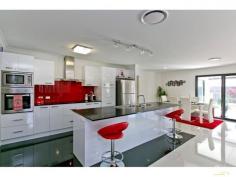  37 Spotted Gum Mount Cotton QLD 4165 Inspection a Must! Inspection Times: Sat 22/08/2015 10:00 AM to 10:30 AM DON'T Miss Out On Inspecting this outstanding home.  Ready for the person looking for peace and tranquillity, with the ease of having all necessities close by.  The kitchen is perfect for entertaining guests and family, it has a huge island bench (stone benchtops), outfitted with top of the range Blanco Appliances, including Induction Cook top and dishwasher.  The Master bedroom over looks the pool area and includes a huge walk-in wardrobe and large ensuite. All bedrooms are generous in size with big Built ins. Massive walk in linen and storage cupboard. Ducted Air conditioning throughout the home.  The generous open plan living area opens up onto the covered alfresco deck, allowing effortless year-round entertaining. This area, overlooking the sparkling In ground pool, low maintenance, landscaped gardens with lush grassed areas in both front and rear yard.  Great electricity savings with 12 solar panels, 5000 litre water tank, 6x4 garden shed, Double remote garage with storage, crimsafe security screens and doors.  You will be impressed! Guaranteed! PROPERTY DETAILS Offers Invited NOW! ID: 332484 Land Area: 715 m² 