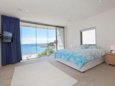  52 Kingsley Dr Boat Harbour NSW 2316 Think Outside the City An absolutely unique chance to purchase an iconic property at idyllic Boat Harbour in Port Stephens ideal holiday home or sea-change opportunity. Whaleview is an absolute beachfront 3-storey executive residence that offers outstanding facilities, and it has its own access to the most picturesque and safe oceanfront beach in the area. Whaleview is an exciting opportunity to acquire the perfect holiday home, and also offers those seeking that sea-change the ideal location. It is just 2 hours drive from Sydney, and 30 minutes from Newcastle airport, which services Sydney, Melbourne, Brisbane, Gold Coast and Taree. Boat Harbour itself is a tranquil community where the sea-changer or holiday maker will feel at home, but it's also close to the many diverse amenities and activities the Port Stephens area has to offer. Access to your own beach is assured, while the famous surfing beaches of One Mile, Birubi and Stockton are only minutes away, as are thriving communities like Nelson Bay, Shoal Bay and Fingal Bay. Activities in the area include snorkelling, go-karting, sand-boarding, camel riding on the amazing Stockton dunes, quad-biking, 4-wheel driving on the beach, the nearby toboggan park and, of course, whale-watching, which you can do from the comfort of your own home. No chance for your children to get bored! Or just explore the breathtaking and naturally beautiful areas the region has to offer. And the house? That will disappoint no-one! Whaleview is a stunning, much admired architect-designed home that offers an amazing lifestyle opportunity, with a seamless blend of sophistication, style and comfort. Spread over three levels, it offers a floor plan that promotes not only great separation of living, but is also built to absolutely maximise its idyllic location and showcase its picture-postcard vista, with amazing open views from every room. The entry level comprises a designer kitchen with Miele appliances and stone benches, huge tiled lounge/dining area, laundry, powder room, master bedroom and ensuite with an opulent round spa bath, all with underfloor heating. The lower level offers a huge rumpus/dining room with wood-panelled ceiling and kitchen area, bathroom with shower, large storage area, and a bedroom with plenty of space for four king-single bunks or a couple of queen beds. This level is a perfect area for children and guests. The top level comprises a large, stunning study with views straight out to the ocean, two oversize bedrooms with built-ins, a very generous bathroom and another living area with sink. Externally, you will find generous decks for alfresco entertaining, again with those stunning views, as well as a courtyard. A huge triple lock up garage with ample storage completes the picture. The home offers first-class fixtures and fittings throughout and a first-class build quality, combined with a cutting-edge design in complete synchronicity with its magnificent surrounds...this home truly shines. There is a plethora of features, some obvious, some subtle, that all enhance the home's overall livability, comfort and aesthetic appeal. These include a grand entry with flowing water feature that runs from outside to inside, raked ceilings, ducted vacuum with handy sweep-in suction point in the kitchen, state-of-the-art security system including coded entry at front gate, security cameras that record activity and that are viewable remotely from mobile devices, audio system throughout, extensive computer Ethernet cabling, telephone system with driveway gate remote and intercom and much more - the calibre of this home is reflected in the paramount attention to every little detail. Even the glass has nano-technology embedded, so that a simple hose-down is enough to get them sparkling! A house of this quality in such a location in any city would demand an investment of at least 3 times that of Whaleview. So think outside the city! Watch the whales migrate, fish, swim, take leisurely walks, snap stunning photographs...do whatever you please in this world-class location that would be hard to beat - by any standard. *Striking tri-level architect designed home...absolute beach front *4 Bedrooms + study, 3.5 Bathrooms, 2 Kitchens, multiple living areas *Family friendly floor plan promotes privacy and separation of living *Premium fixtures and fittings throughout paramount attention to detail *Abundance of glass to showcase spectacular water views from each level *Grand entrance with stunning water feature flowing from outside to inside *Footsteps to sand and water - watch the whales frolic... life is so good *Iconic local property in a golden, blue-chip location, amazing opportunity. 