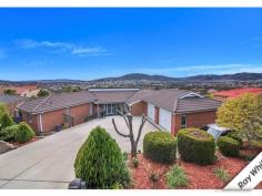  16 Clem Hill St Gordon ACT 2906 Room to Grow While Owning the View! Located in Gordon, with undulating views of the valley and all the way to Black Mountain Tower lies this outstanding 5 bedroom home with so much to enjoy! Soak in the view from every living room angle. A north facing aspect and abundance of natural light is shared through the home creating space and warmth and a place to love. The living rooms are treated to chic and modern roller blinds and are a combination of carpet and floating timber floor boards and neutral colours. This kitchen will have the family fighting over the dishes, especially as the homes view is best enjoyed from the space. The kitchen is truly the hub of this remarkable home, overlooking the family room and easily accessible from the lounge/rumpus room, rear deck and dining spaces, ensuring meal preparation and entertaining guests is one of ease and delight. Outdoors is just as impressive as in. The rear deck offers a large covered entertaining area, an extension to the living rooms and nestles around the home and includes an outdoor spa. The garden is fully enclosed with a grassed area for the kids to play and pets to roam with matured and easy care gardens for the parents to appreciate and just enjoy. The large main bedroom is segregated and offers a walk-in robe and spacious ensuite. The additional bedrooms are generously sized and are completed with ceiling fans, built in robes and brand new carpet. A double garage under roofline, with internal access and remote doors plus designated car spaces and trailer bay ensure that all toys are secured and are easily maneuvered on the convenient and effective 801m2 block. Additional features enjoyed by this home include stainless steel gas kitchen appliances, double draw dishwasher, ducted gas heating, reverse cycle air conditioning, ducted vacuum, fresh paint, newly carpeted bedrooms and plenty of under house - in house round house storage! 