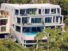  36 Gurney Cres Seaforth NSW 2092 $11,000,000 The Ultimate Harbourside Mansion This incredibly substantial and architecturally designed master built mansion and has been designed with extreme comfort, premium quality and luxury in mind while privately nestled amongst the trees on a double lot. Prominently positioned with almost 1000m2 of luxurious modern living across three levels. It is unsurpassed in design, quality and location. The beautiful surroundings are further embraced with 20-metre wide terraces on each of the three levels. The home offers spectacular 210-degree panoramic views of Middle Harbour from every level. The tranquil views of untouched waterfront reserves, secluded harbours and endless pristine blue waters create the impression that you are living in a private paradise, while being only 30 minutes from Sydney CBD, and just moments from Seaforth shops, restaurants, schools, parks, golf courses, and transport to the city and the popular northern beaches. - 2 Gourmet kitchens & one Kitchenette - Entertainment room and home theatre with home-wide audio system - Heated flooring, double sided gas fireplace - Fully approved three bedroom guest house - separate accommodation - Specially designed home gymnasium - Wine cellar - holding 1200+ bottles - C-Bus system with colour touch screen - Fully integrated security system with infra-red cameras - Sauna fully imported from Finland - Eco friendly BASIX Certified home - Glamorous infinity gas heated 11 metre wet edge pool with Jacuzzi and two spas - Koi fishponds, water features, landscaped grounds - Boat moorings and a fenced public sea pool in a waterfront reserve - Two street access Inspect by Appointment - Mark Clarke 0407 600 211 
