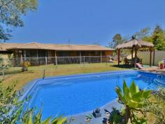  23 Back Creek Rd Beerwah QLD 4519 $700,000 Large Property! Large Home! Great Price! Great acreage in town (over 3.5 acres) with 2 complete homes under 1 huge roof!  The property offers the quality lifestyle that only a large acreage can offer with the huge home (over 360m2 under the roof!) specifically designed to accommodate 2 large families living separately under the same roof.  On Offer we have: 1. 	 Property • 	 3.5 acres app. level and usable fenced property, ideally positioned to take advantage in the future of the ever growing Beerwah township. • 	 11 year old Coral Brick & tile home with over 360m2 app. under the roof 2. 	 2 Complete residences, under the same roof. Residence No 1. • 	 4 Bedrooms with build ins, main with en suite and walk in robe • 	 2 Bathrooms and 2 toilets • 	 Large kitchen and large dinning/ living with bay windows and sliding doors for natural light leading to the undercover entertainment area and the in ground swimming pool • 	 Separate family room • 	 Large veranda on the front and back overlooking the enclosed entertaining area with a gazebo and in ground swimming pool. Residence No 2. • 	 3 Bedrooms with build ins • 	 Brilliant 2 way bathroom, separate toilet and wash basin room • 	 Great kitchen with large dining room/living room • 	 Separate family room • 	 Ducted vacuum throughout the house. The list of what this property is offering is endless! Situated in the thriving township of Beerwah with its progressive shopping center (Woolworths, ALDI, Super IGA, brand new shopping center) public transport (Trains and Buses) as well as public and private primary and high schools, approximately 20min. from the glorious Sunshine Coast Beaches and just a short drive to Brisbane (under 1 hour app.) the property is perfectly positioned to take advantage for the ever expanding Beerwah township. For your own private inspection of this Sunshine Coast Hinterland paradise please contact the exclusive agent today. 
