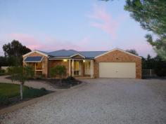  2 Bateman Dr Echuca VIC 3564 $520,000 Solid Home, Pool, 1 Acre, Lovely Echuca Estate - This wonderful comfortable family home located in the desired Chelsworth Estate just five minutes from town is an ideal home if you are downsizing or looking for a bit more room on 1 acre. Surrounded by excellent maintained gardens with a one mega litre of water for the garden. This Immaculately presented three bedroom home is a treasure waiting to be found. Offering 3 living areas and relaxed living inside and out with a pool and lovely undercover outdoor entertaining. In addition this home offers an elegant formal living/dining area, casual open plan functional kitchen with dishwasher, dining and living, plus a study. The home has ducted evaporative cooling and gas ducted heating and double remote garage. The master bedroom has a walk in robe and generous ensuite with a spa bath and a generous laundry with ample storage. Two further bedrooms with BIR's and a third living area completes the home. Outside are two sheds each are 7.5m by 5.5m. This premium estate is town serviced and complimented by wide streets substantial homes, close to schools, transport and town. 