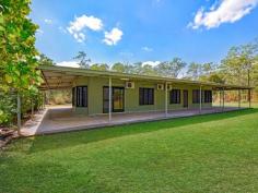  1035 Goode Rd Humpty Doo NT 0836 $770,000 New Standard in Rural Living HUGE $55,000 price reduction - this gorgeous rural property won't last at this price therefore, make an appointment today. Setting a whole new standard in rural living, this home is almost too good to be true. Featuring massive wrap around verandahs and wonderful outdoor living spaces coupled with expansive internal living rooms and a grand master bedroom suite - this is a large family home designed with function and form and is sure to impress. * Lovely rural abode with expansive living areas inside and out  * Large 370 sqm Pat Jackson' home built in 2010 * Open plan living and dining areas with porcelain tiled flooring  * Modern kitchen has huge stone island bench, pantry and ample storage  * Master bedroom complimented with bay windows, WIR and ensuite  * 3 bedrooms with BIR, split a/c and porcelain tiles underfoot * All rooms feature large louvred windows with views of the property * The main bathroom complete with relaxing bath tub  * 3 metre wide wrap around verandahs offer wonderful outdoor space  * Large above ground swimming pool will be a hit with the kids (of all ages)  * 7 x 7m workshop with twin roller doors and power * 2 bay carport and recycled bitumen driveway * 10 lps bore and 25,000 ltr rain water tank  * Automated irrigation system with 10 stations * High and dry block with lovely tall timbers and native bush  * Fully fenced on approx. 5.76 acres Stepping inside is like stepping into your dream home, where wide open spaces create wonderfully light living areas for easy entertaining and everyday living. Bay windows filled with louvres allow for plenty of light to bounce around the glossy porcelian tiled flooring, with the raked ceilings adding another dimension to the space. If the living room sounds impressive, have a look at the contemporary kitchen that awaits the everyday master chef. Offering a large stone island workbench and breakfast bar, there is also a pantry along with a bounty of overhead storage, wall mounted appliances and a gorgeous grey tone colour palette that will stand the test of time. All four bedrooms are of grand portions yet it is the master bedroom that really stands apart with its walk in robe and large ensuite along with bay windows and sliding door access to the verandah. All of the bedrooms feature porcelain tiled flooring along with split A/C and a built ins to bedrooms 2, 3 and 4. Outside this home continues to impress with verandahs that wrap around all sides of the home offering plenty of spaces to entertain or just enjoy the wonderful Darwin weather outdoors. The kids can ride bikes around the home, there is space for the pets to shelter and of course - ample space for the BBQ and outdoor dining suite. This lovely 5.76 acre property also offers a 7 x 7m powered work shed and a 2 bay carport. The native trees have been cleared around the home ensuring an easy weekend mow that will keep it all looking fabulous, green lawns surround the home itself. Tall timbers and lovely native bush fill the perimeter giving the property privacy. The home is perfectly located towards to the back of the block therefore, making it versatile should you require room for a granny flat or just simply enjoy this ample space. Located a short drive from the popular Humpty Doo Tavern, Golf Course, shops and plenty of schools for the kids, this stunning rural abode has a suburban feel mixed with the tranquil lifestyle you desire - so what are you waiting for? View this lovely property this weekend. Year Built: 2010 Area under title: approx. 5.76 acres Zoning: RL (Rural Living) Council Rates: approx. $1,070 per annum Easements: None Found 