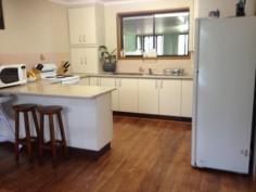  6 Basil Ave Parkes NSW 2870 $275,000 Quiet & Comfortable Situated in a quiet cul.d.sac, this brick home has four bedrooms, open plan lounge/dining area, spacious kitchen with walk-in pantry, three way bathroom, large family room with split system and doors opening onto entertaining area, there is also a Balinese style entertaining area, colourbond garage and workshop and secure yard.The home has new flooring and fresh paint, ducted evaporative a/c and gas heating. DETAILS ID #: 0000265300 Price: $275,000 Type: House Bed: 4    Bath: 1    Car: 1     Land Area: 636 sqm (approx) 