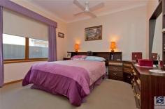  4 Gordon St Wodonga VIC 3690 $349,000 SOLID CENTRAL CHARMER 3 2 5 Only 500m from the Water Tower in the centre of Wodonga you will be surprised to find this charming 3 bedroom home with 2 bathrooms. 4 Gordon Street is a very practical home in every sense, from the modern kitchen to the powered workshop, it offers a lovely sanctuary for all who enter. Vinyl floating floors, warm wood tones throughout and a lovely, low maintenance garden come together to make this one very attractive home.  The master bedroom, at the rear of the home, has a delightful ensuite & walk in robe. Both of the other bedrooms are generous in proportion & each offers built in robes. Having a large lounge with separate dining area & an additional living area adjacent to the kitchen means that you have options on how to use each room – depending on whether you have children that you need to escape from. The decor of the modern kitchen is light & neutral in tone and is complemented beautifully by the deep warmth of the wood-look flooring. A double glass sliding door from the family room opens out to a paved verandah that is a fantastic sun catcher on those crisp winter days.  For the handy man or woman, the original garage at the rear of the property makes an ideal workshop with power & a roller door. For outdoor entertainment you have both covered and open areas complimented by a cute fish pond and gorgeous garden, all easily accessed by steps or a ramp. Too many cars? This property may suit your needs with a double enclosed carport at the front, room for 2 cars undercover directly behind this and the garage/workshop if required. With sports facilities just down the road an afternoon watching a match, keeping fit or walking the dog is definitely on the cards. Don’t miss the opportunity of owning this solid home in a great location. Additional information Property Type House  Property ID 11042100297  Street Address 4 Gordon Street  Suburb Wodonga  Postcode 3690  Price $349,000 