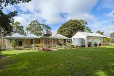  30 ALISONS Rd Drummond North VIC 3446 $620,000 Property ID 35389 Set amidst 25 acres (approx.) of picturesque undulating farmland with beautiful views of Mount Macedon, Belltopper and the Great Dividing Range, this historic property is a real gem. The homestead began its life as the shearers' quarters for a larger property, and has been extended over its century-long lifetime to become a lovely family home with a wonderful feel.  The accommodation comprises three bedrooms, two bathrooms, living room with Heatcharm wood fire, and dining room with open fire place. The kitchen is a great size and retains the original wood-fired stove. Panelled ceilings and beautiful wide floorboards are a feature throughout the home. The original weatherboard barn/stables offer an amazing chance for restoration, or renovation into further accommodation or a studio. Further outdoor features include the milking shed, a four car garage, two car carport, excellent fencing and a spring water bore. The garden includes lovely mature English trees, fruit trees and beautiful gums. Located five minutes from Malmsbury, ten minutes from Kyneton and a little over an hour by rail or freeway from the Melbourne CBD, this property presents a golden opportunity to acquire a lovely period home on beautiful acreage - a piece of local history - and refresh it for the 21st century. Land area 10.12Ha 