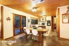  4 Trudy Pl Mt Evelyn VIC 3796 $890,000 plus Love At First Sight! Sale by SET DATE 29/9/2015 (unless sold prior) It would be hard to imagine a more idyllic family residence than this gorgeous, brick home poised upon an acre-and-a-half of beautifully landscaped, native gardens which deliver a lifestyle of comfort and enjoyment. Inspired with renowned 'Merchant Builders' style homes in mind, this lovely home effortlessly blends with the abounding greenery, and, via a profuse amount of glazing, frames glorious views from every room which allows the natural light inside, whilst several access points link internal areas with the fabulous outdoor recreation and entertaining spaces. Beautifully appointed and appealing, the homes extensive, flowing layout boasts a cosy sitting room looking out to the beautiful gardens, a vast sunken lounge showcasing Cathedral ceilings producing unique dimensions; as well as a blazing open brick fireplace (with inset guard), bluestone bar and near-new 100% New Zealand wool carpet adding a luxury touch, along with timber sliding doors accessing the central courtyard. Furthermore, there is also a considerable, carpeted rumpus and a tiled meals space or family zone ensuring family harmony - both areas opening for entertaining to flow out to the huge patio and gardens. An attractive 'country-style' kitchen is replete with plentiful cabinetry, a walk-in pantry and appliance cupboard plus modern surfaces and quality appliances including dishwasher; overseeing the living spaces for catering ease. Furthermore, there are also four sizeable bedrooms (or three robed and a private study), serviced by a spacious family bathroom with separate shower and bathtub, all bathrooms also feature heated towel racks. Outdoor enjoyment is assured with designated entertaining, recreation and vegetable gardens. Boasting a sparkling 150% solar-heated swimming pool and a mains gas-heated, 10-seater spa, sun/pool deck, gazebo, patio with mains-gas BBQ, fire-pit and extendable awning, plus chook house and run, segregated boxed veggie patches, wood-shed, a powered workshop or man-cave with wood-fire heater plus a wood-fire oven created out of natural stone, 27000lt water tanks with pumps, automatic irrigation system and a remote double garage with internal entry and an adjoining home-office, gym or fourth living space! Further notable highlights also include hydronic heating, evaporative and refrigerated cooling, ducted vacuum and alarm system, a huge fitted laundry ideal for drying clothes in winter, Foxtel dish, repointed Terracotta roof, internal Cedar doors and vogue lighting. Located in the bowl of a private court setting just minutes' walk to St Mary's and Mt Evelyn Primary's, child-care and kinder, the Warburton Trail and local shopping, with easy access to Lilydale amenities, shops and rail transport, the National Park ,Yarra Hills Secondary, wineries and restaurants, everything about this outstanding abode will be sure to instantly capture your heart. An inspection is the only way to discern all this spectacular home has to offer, enquire now! Features Study 