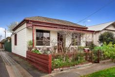  1 Queen St Coburg VIC 3058 $660,000-$720,000  Regal Presence On Queen In a coveted pocket of Coburg, moments to Melville Road, transport and schools this three bedroom block facade Victorian offers spacious family living. Generously proportioned the home welcomes you via a high veranda with city views to a wide hallway off which three large bedrooms, serviced by two bathrooms, are located. The rear opens to a bright and spacious living room with timber floors and a stylishly refurbished kitchen and meals area with feature pressed metal splash back and dishwasher. A covered alfresco area and generous rear garden completes the picture while the adjacent laneway and convenient ROW to a garage and workshop makes access a breeze. Features include ducted heating, split system air-conditioning and easy access to CityLink. 
