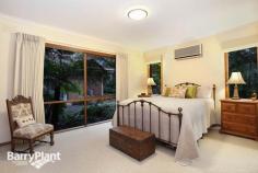  4 Trudy Pl Mt Evelyn VIC 3796 $890,000 plus Love At First Sight! Sale by SET DATE 29/9/2015 (unless sold prior) It would be hard to imagine a more idyllic family residence than this gorgeous, brick home poised upon an acre-and-a-half of beautifully landscaped, native gardens which deliver a lifestyle of comfort and enjoyment. Inspired with renowned 'Merchant Builders' style homes in mind, this lovely home effortlessly blends with the abounding greenery, and, via a profuse amount of glazing, frames glorious views from every room which allows the natural light inside, whilst several access points link internal areas with the fabulous outdoor recreation and entertaining spaces. Beautifully appointed and appealing, the homes extensive, flowing layout boasts a cosy sitting room looking out to the beautiful gardens, a vast sunken lounge showcasing Cathedral ceilings producing unique dimensions; as well as a blazing open brick fireplace (with inset guard), bluestone bar and near-new 100% New Zealand wool carpet adding a luxury touch, along with timber sliding doors accessing the central courtyard. Furthermore, there is also a considerable, carpeted rumpus and a tiled meals space or family zone ensuring family harmony - both areas opening for entertaining to flow out to the huge patio and gardens. An attractive 'country-style' kitchen is replete with plentiful cabinetry, a walk-in pantry and appliance cupboard plus modern surfaces and quality appliances including dishwasher; overseeing the living spaces for catering ease. Furthermore, there are also four sizeable bedrooms (or three robed and a private study), serviced by a spacious family bathroom with separate shower and bathtub, all bathrooms also feature heated towel racks. Outdoor enjoyment is assured with designated entertaining, recreation and vegetable gardens. Boasting a sparkling 150% solar-heated swimming pool and a mains gas-heated, 10-seater spa, sun/pool deck, gazebo, patio with mains-gas BBQ, fire-pit and extendable awning, plus chook house and run, segregated boxed veggie patches, wood-shed, a powered workshop or man-cave with wood-fire heater plus a wood-fire oven created out of natural stone, 27000lt water tanks with pumps, automatic irrigation system and a remote double garage with internal entry and an adjoining home-office, gym or fourth living space! Further notable highlights also include hydronic heating, evaporative and refrigerated cooling, ducted vacuum and alarm system, a huge fitted laundry ideal for drying clothes in winter, Foxtel dish, repointed Terracotta roof, internal Cedar doors and vogue lighting. Located in the bowl of a private court setting just minutes' walk to St Mary's and Mt Evelyn Primary's, child-care and kinder, the Warburton Trail and local shopping, with easy access to Lilydale amenities, shops and rail transport, the National Park ,Yarra Hills Secondary, wineries and restaurants, everything about this outstanding abode will be sure to instantly capture your heart. An inspection is the only way to discern all this spectacular home has to offer, enquire now! Features Study 