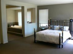  68 High St Marong VIC 3515 $430,000 - $445,000 Spacious 32 Square Exective Style Home Located in increasingly popular Marong is this large modern B/V executive style home offering approx. 32 squares of very comfortable living. Features include 4 large bedrooms with built in robes with the main offering a walk-in robe, 3 piece bathroom/on suite with separate toilet, double vanity, spa bath and private courtyard, study, 3 living areas & dining off the kitchen including the theatre room at the rear of the house, and 9 foot ceilings.  The stylish kitchen features a fantastic SS 5 burner gas range, rangehood, dishwasher, walk-in-pantry, space for double door fridge and a breakfast bar. Ducted zoned heating/cooling provides year round comfort.  Outdoors find a double garage with internal access, alfresco and vehicle access to the rear yard which offers plenty of space for a large shed. Securely fenced on approx. 1000 sq m block and very well presented, this home offers a semi-rural aspect yet walking distance to kinder/school, secondary school bus stop, milk bar and local pub, all this just 15 minutes from the Bendigo CBD.   Property Snapshot  Property Type: House Construction: Brick Veneer House Size: 32.00 m2 Land Area: 1,000 m2 Features: Built-In-Robes Close to schools Close to Shops Courtyard Dishwasher Ducted Heating Ensuite Garden Shed Gas Lounge Outdoor Living Remote Control Garaging Spa Storage Study Undercover Entertainment Area Walk in Pantry Walk-In-Robes 