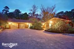  4 Trudy Pl Mt Evelyn VIC 3796 $890,000 plus Love At First Sight! Sale by SET DATE 29/9/2015 (unless sold prior) It would be hard to imagine a more idyllic family residence than this gorgeous, brick home poised upon an acre-and-a-half of beautifully landscaped, native gardens which deliver a lifestyle of comfort and enjoyment. Inspired with renowned 'Merchant Builders' style homes in mind, this lovely home effortlessly blends with the abounding greenery, and, via a profuse amount of glazing, frames glorious views from every room which allows the natural light inside, whilst several access points link internal areas with the fabulous outdoor recreation and entertaining spaces. Beautifully appointed and appealing, the homes extensive, flowing layout boasts a cosy sitting room looking out to the beautiful gardens, a vast sunken lounge showcasing Cathedral ceilings producing unique dimensions; as well as a blazing open brick fireplace (with inset guard), bluestone bar and near-new 100% New Zealand wool carpet adding a luxury touch, along with timber sliding doors accessing the central courtyard. Furthermore, there is also a considerable, carpeted rumpus and a tiled meals space or family zone ensuring family harmony - both areas opening for entertaining to flow out to the huge patio and gardens. An attractive 'country-style' kitchen is replete with plentiful cabinetry, a walk-in pantry and appliance cupboard plus modern surfaces and quality appliances including dishwasher; overseeing the living spaces for catering ease. Furthermore, there are also four sizeable bedrooms (or three robed and a private study), serviced by a spacious family bathroom with separate shower and bathtub, all bathrooms also feature heated towel racks. Outdoor enjoyment is assured with designated entertaining, recreation and vegetable gardens. Boasting a sparkling 150% solar-heated swimming pool and a mains gas-heated, 10-seater spa, sun/pool deck, gazebo, patio with mains-gas BBQ, fire-pit and extendable awning, plus chook house and run, segregated boxed veggie patches, wood-shed, a powered workshop or man-cave with wood-fire heater plus a wood-fire oven created out of natural stone, 27000lt water tanks with pumps, automatic irrigation system and a remote double garage with internal entry and an adjoining home-office, gym or fourth living space! Further notable highlights also include hydronic heating, evaporative and refrigerated cooling, ducted vacuum and alarm system, a huge fitted laundry ideal for drying clothes in winter, Foxtel dish, repointed Terracotta roof, internal Cedar doors and vogue lighting. Located in the bowl of a private court setting just minutes' walk to St Mary's and Mt Evelyn Primary's, child-care and kinder, the Warburton Trail and local shopping, with easy access to Lilydale amenities, shops and rail transport, the National Park ,Yarra Hills Secondary, wineries and restaurants, everything about this outstanding abode will be sure to instantly capture your heart. An inspection is the only way to discern all this spectacular home has to offer, enquire now! Features Study 
