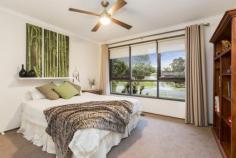 1 Bainbridge Ct Kilsyth VIC 3137 $520,000 Plus Family Appeal In A Well Serviced Locale Displaying an undeniably charming streetscape with its lush meticulous gardens and covered front deck enjoying the northerly aspect, this substantial family home on a large block of 873sqm (approx.) is at once, delightfully engaging. High ceilings and rich, polished floorboards add further appeal to the homes impressively presented interiors comprising a large formal lounge with a central sliding door ideally opening up or closing off the immense family zone and open plan meals area. Additionally, further sliding doors open out to a vast covered entertainer's patio affording views of the Dandenong Ranges, and the large secure rear gardens perfect for kids and pets to run around. Overseeing is the modern kitchen equipped with quality appliances including Westinghouse gas cooktop and electric oven with separate grill plus a Dishlex dishwasher, along with a double pantry and plentiful cabinetry. Comfortably accommodating the homes residents are four considerably sized bedrooms, all fitted with built-in robes and sharing the chic family bathroom featuring statement tiling and a semi-frameless shower, in addition to a deluxe full ensuite boasting dual vanities, feature tiling and a frameless double rainfall shower complementing the master bedroom with walk-in robe. Further benefits include gas ducted heating, reverse cycle air-conditioners to both living areas, ceiling fans, solar panels, fitted laundry with storage, roller blinds, separate toilet, tile roof re-pointed 2 years ago, garden shed, off-street parking, double carport and double gated access to secure parking for a trailer. Residing in an exceptionally well serviced location close to a choice of highly regarded schools, swim centre, Elizabeth Bridge Reserve, Churinga Village Shopping Centre and Mooroolbark with rail station, along with convenience to Croydon, Lilydale, the Yarra Valley and Ringwood with Eastland Shopping Centre and EastLink, this engaging abode is certain to impress. Enquire now! Features Built-In Robes Reverse Cycle Air Con Outdoor Entertainment Area Dishwasher Deck Floorboards Air Conditioning 