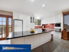  65 Denny St Latham ACT 2615 $800,000 Entertainers Delight Space. Light. Flexibly. Quality. Value. There are so many terms to describe this home. From high ceilings, expansive open plan living and entertainment areas to the northern rural outlook, this home has it all. Fully remodelled to a very high standard, the kitchen and bathrooms are a dream. A spacious light filled family, meals, kitchen area flows through French doors onto extensive timber decking. Segregated bedrooms, a huge laundry, music room, extra large rumpus or a studio with surround sound, extensive under house storage including a cellar and direct access to 4 car garaging. Displaying stunning panoramic bushland views over Umbagong Reserve and Ginninderra Creek from the living areas and decking. A sparkling, solar heated, in ground pool is overlooked by an all weather covered cabana area, ideal for alfresco dining. It is an entertainer's dream. Ideal for the growing or extended family.  Whether it is the birdlife, the breath taking sunsets overlooking the Brindabella, the light, space and other amenities, or simply a great place to live, in the owners words "It is a neighbourhood full of beautiful people and a tightly held secret. It is like living in the country with all the city's conveniences." Enjoy:  - Awesome views.  - 4 bedrooms with 1 study/office.  - 2 bathrooms that are fully renovated.  - Spa Bath.  - Wall to ceiling tiles.  - North facing.  - 3 large entertaining decks.  - Music room.  - Wiring for surround sound movie system.  - Huge Rumpus that can fit a billiard table.  - Wine Cellar.  - Storeroom / workshop.  - Huge family room including meals area.  - Recessed lighting.  - 4 car enclosed car accommodation with automatic roller door.  - Keyless remote entry.  - Reverse cycle air conditioning.  - Gigantic laundry.  - In ground salt water solar heated pool.  - Hardwood polished floors to living areas.  - Spacious modern kitchen with granite benchtops.  - Fish pond.  - Digital antenna.  - Foxtel Cabling. Do yourself a favour and come and look at this majestic home and compare the value and all the bonuses that you are getting compared to the new suburbs. This home is close to shops, public transport and schools yet it has a setting which is quiet and tranquil and that gives you a sense of peacefulness. For more information please call Greg Sadil on 0414 631 607 Energy Efficiency Rating: 2.0-star NABERS Energy Rating For Sale Offers Over $800,000 Features General Features Property Type: House Bedrooms: 5 Bathrooms: 2 Indoor Study Floorboards Built in Wardrobes Rumpus Room Reverse cycle Air Conditioning Outdoor Remote Garage Secure Parking Garage Spaces: 4 Deck Outdoor Entertaining Area Fully Fenced Swimming Pool - Inground Eco-friendly Inspections Inspections by appointment only. 