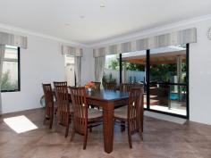  2 Monte Carlo Heights Port Kennedy WA 6172 $895,000 Two Homes in One..! Located in a sheltered spot in the Ocean Edge estate approx. 250m from award winning Warnbro Beach, this superb home has a massive 420sqm of living area extending over 3 levels on a generous 707sqm block. It is like 2 homes in 1. The main living area has a huge open plan family & dining area which is adjacent to a large chef's kitchen & breakfast bar. There are 3 spacious bedrooms the main with custom robes - 2 ensuite bathrooms and a ground floor powder room. An attached guest quarters/granny flat has a huge bedroom, ensuite bathroom, lounge/living room and kitchenette, and can be accessed either internally or externally from the main house, so privacy is assured. A feeling of spaciousness is enhanced by a void over the family area, and high ceilings throughout the ground floor. The main living areas overlook a stunning b/g pool wrapped around a gazebo, nestled in a beautiful landscaped garden. Unwind to the sound of water splashing down the pool's waterwall and rising from the bubblers close to the gazebo's bridge. Or go to the movies in the fully equipped home theatre room. There is also a large ground floor home office just off the front entry, a huge, 30 sqm loft accessed by the 2nd staircase, and a large storage space/wine cooler under the main staircase. A "Webb & Brown Neaves" house, it is well built and has quality fittings throughout. It is cooled & heated by 2 separate reverse-cycle, ducted A/C units with another reverse-cycle A/C unit in the loft. Curtains and pelmets frame the windows in all living areas and bedrooms, and floors have lovely woollen carpet or porcelain tiles. There is a fully monitored security system, smart-wiring and an integrated entertainment system that plays music throughout the main house & outside entertainment area as you chose. Secure parking is provided by the 2 and a half car-sized garage. Storage space abounds throughout the house and garage. 