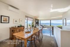  8A Dynnyrne Rd Dynnyrne TAS 7005 $920,000+ Stunning views, light and contemporary livingBuyers looking in the $920,000+ price range4 3 2  Privately set back off the road, enjoying a sunny, elevated position and spectacular water views, this spacious contemporary home boasts a functional floorplan revolving around a magnificent internal courtyard providing sheltered seamless indoor/outdoor living and acting as an abundant light well for the main living area. Architecturally designed and finished to a high standard, double glazing throughout ensures thermal efficiency and effectively insulates against traffic noise. Open plan living comprising a modern, well equipped kitchen with quality joinery and warm timber accents, dining and lounge area forms the heart of the home. This space benefits from extensive glazing, showcasing the ever changing vista of the River Derwent. Further living space that also acts as a third and fourth bedroom is accommodated on the lower ground floor. The private master suite incorporates a stylish ensuite bathroom and generous walk-in-wardrobe. The second bedroom on the upper level is serviced by a luxurious family bathroom with deep tub and the further two bedrooms on the lower floor are adjacent to a shower and powder room. A study or storage area and laundry complete the floorplan. A remote gated driveway with off street parking, double garage with internal access and a workshop/storage area with development potential provides modern convenience. Located on the cusp of Sandy Bay and Dynnyrne, close to the UNI, local schools, shops and amenities of Sandy Bay, this is an exceptional opportunity to acquire a relaxed, easy lifestyle against a picturesque backdrop. reference: 	 331527 building size: 	 250.00 sq m property type: 	 Residential land size: 	 618.00 sq m 