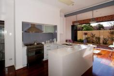  8A Barrett Street Wembley WA 6014 $999,000 THIS ELEVATED 1940'S CLASSIC WILL PLEASE CHARACTER LOVERS AND MODERNISTS ALIKE Open Sat 24/10 12.15-1PM When the beautiful features of the 1940's combine with up-to-date practicality, the results are amazing. Leadlight doors and windows are offset by modern Bi-folds, one of the bathrooms is sleek and contemporary, while the other has a romantic feel with a clawfoot bath and original wash basin and a minimalistic black and white palette. There is nothing 1940's about the kitchen though. It is fabulously 'now' with floor to ceiling storage, a clean-lined functionality with caesar stone workbench and stainless steel appliances. Plus as the fridge fits the space so perfectly, it is included in the sale.  There are 2 separate living areas and a formal dining area that is perfect for dinner parties or family meals. With High ornate ceilings, and sensational polished floorboards throughout, the light is fairly bounced around the home, enhanced by the beautiful leadlights in the doors and windows. Plus, with a street appeal that is sure to delight, this home has the lot!  COMPRISING • 	 3 bedrooms, 2 bathrooms & powder room • 	 Formal lounge and formal dining • 	 Open plan casual living with bi-fold doors to courtyard • 	 Beautifully designed kitchen FEATURES • 	 Ducted Air-conditioning • 	 Gleaming jarrah floors throughout living spaces • 	 Security system • 	 Reticulated back and front • 	 Electronic shade sail • 	 Gas appliances • 	 Plenty of built-in storage • 	 Leadlight windows and doors • 	 High ceilings and feature fireplace • 	 Dishwasher and fridge • 	 Undercover parking The location of this home is superb. If you cannot afford the huge prices that Subiaco commands, then this is the next best thing as this classic is right on the border. Thus you can enjoy all the delights of both suburbs from excellent shopping, cafes, schools and parks as well as having easy access to the city. AGENTS COMMENT With its pristine condition, copious added extras and brilliant location, this 3 bedroom 2 bathroom would suit executive buyers and families alike. Shire rates: $2247 pa Water rates: $1189 pa Open Times Saturday, 24 Oct 2015 12:15 pm- 1:00 pm Property Features Air Conditioning Property Details Price 	 From $999,000 State 	 WA Region 	 Western Suburbs Suburb 	 Wembley Postcode 	 6014 Property Type 	 House Bedrooms 	 3 Bathrooms 	 2 Carspaces 	 2 Land Size 	 360 Square Metres Open Times 	 Saturday, 24 Oct 2015 12:15 pm - 1:00 pm 