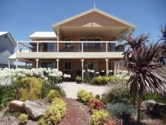  41 Grahn Rd Sandilands SA 5571 $438,000 Stunningly Located Coastal Home Why build when you can just walk into a home like this? With spectacular sea views across the gulf, this 2 storey home is in new condition perched high in the heart of James Well and set amongst other quality homes.  The magnificent balcony, with its panoramic sea views, has access from both the living room and master bedroom and being approximately 10m x 4m (with over half undercover of the main roof) is easily large enough to entertain many of your closest friends. Comprising 4 bedrooms, master upstairs with built in robes, dual access ensuite including double shower, spacious open living, dining room and kitchen with dishwasher, double sink and ample bench space. Reverse cycle split system air conditioning and tiles throughout the living areas make life even more comfortable if that's possible. Down stairs are bedrooms 2, 3, and 4, a second living area, laundry and the main family bathroom. Several built in storage options are also available throughout the home. The front and rear yards are low maintenance and rain water storage of approximately 45,000 litres is available while under cover parking is provided by means of the gable roofed carport. James Well is located approximately 6 kilometres south of Ardrossan and this relaxing hamlet is a combination of permanent residents and people just enjoying some time away from the hustle and bustle of everyday living while still only 100 minutes from Adelaide. This premier property deserves your attention so contact Scott Bockmann at our Ray White Ardrossan Office on 0427 519 628 to arrange your inspection today. 