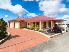  69 Trainers Way Strathalbyn SA 5255 $795,000-$820,000 2 Ha, Master Built 4 Bedroom Home, Beautifully Established Grounds, Shed, Solar Impressive! That will be your comment I'm sure. Located on the outskirts of Strathalbyn amongst similar acreage properties this well cared for Custom Built Home is clearly a standout. With some 450m2 under the main roof - the home boasts 9ft ceilings throughout, four bedrooms all with built-ins, master with walk-in robe plus ensuite and oversize laundry. The separate games room features a Tasmanian Makore Timber bar with the spacious centre hub hosting the kitchen/family/meals area all adjoining an inviting entertaining area. A 3/4 return verandah shades and protects the home through all seasons and double garage has direct access into the home. The home is well serviced by ducted r/c air conditioning, 20,000 gal. rainwater plus mains if required along with a 5KW Solar system. The grounds are immaculate with gravel driveway servicing access to an 18m x 12m (3.7m high) shed/workshop complete with concrete floor, three-phase power and rainwater tank under. Well established fruit trees and vegetable patch will cater for some home grown produce and a well fenced paddock will house a sheep or horse or two! Without a doubt 69 Trainers Way Strathalbyn will cater for those seeking quality and space both internally and externally and in a prime location. Inspection strictly by appointment with the selling agent. 