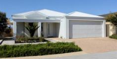  33 Marginson Dr Landsdale WA 6065 $575,000 House This stunning family home offers the very best of contemporary living. It has the perfect blend of modern design and functionality together with an extensive list of quality features. All living areas have 32 course ceilings. Other features include ducted Daikin reverse cycle air conditioning, Beaseley solar hot water system with Rinnai gas booster, 2500 litre rainwater tank which supplies the garden and toilets and Foxtel satellite dish and wiring. The elegant family entertainment room has a day bench, plantation shutters to the windows and French doors which lead out onto a courtyard with natural stone pavers and shade sail. The open plan dining, kitchen and family areas extend out to an UMR entertaining alfresco with beautiful extensive hardwood decking and gas bayonet. Top quality synthetic grass has been used to save you the chore of mowing and the gardens have been designed for easy maintenance. Also outside is an extensive UMR store with loads of shelving and storage space, making it ideal for the handyman or tradie. The modern spacious kitchen has overhead cupboards and lots of storage and worktop space, together with a dishwasher. The master bedroom suite enjoys the luxury of fully fitted ‘his’ and ‘her’ fully fitted walk-in robes and opulent ensuite with walk-in shower and glass block dividing wall. All the other bedrooms are generously sized to accommodate queen beds and have large built-in robes. Like the ensuite, the main bathroom has a walk-in shower and a glass block dividing wall. A laundry with fitted cupboards and bench eases the chore of washing the clothes and there is a gigantic linen press. The remote controlled double garage has a shopper’s entry. Conveniently located near other designer homes with neighbours who have a good sence of ‘community’ this exceptional abode encourages a lifestyle that some of us can only envy. Priced to sell very quickly. Open to view Sunday 1st November from 2pm until 2.30pm Features Built In Robes Courtyard Deck Dishwasher Floorboards Outdoor Entertaining Pay TV Reverse Cycle Aircon Solar Hot Water Service Theatre Walk In Robes Water Tank 