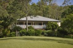  169 Lamington National Park Rd Canungra QLD 4275 $639,000  High on a Hill  Catch the breezes and the views from the spacious veranda from this delightful Queenslander.  Superbly finished Homestead with: * 4 Bedrooms, * Ensuite off main bedroom,  * Huge Carport adjoining the entertainment room with a bar. All this on 5 acres (2.03 Ha) & only 1 and a half kilometres to Canungra Township. Offered for sale at $639,000 Call Canungra Realty today for an inspection House 4 2 Price Guide $639,000  For Sale Land size 2.0300 hectares Inspection times Contact agent for details 