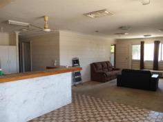  18 Wilga St Blackwater QLD 4717 Light Industrial Land, 2001m2 Block! Set on 2001m2 (approx) of light industrial land in Wilga St, Blackwater is this property with 6 bedrooms, lounge, 2 x kitchens and 2 bathrooms! 3 large shed joined onto the back to make the possibilities endless. With some renovating required, you can personalize your business/home. Features Include; ? 2 x Kitchens  ? 6 x Bedrooms  ? 2 x Bathrooms  ? Open Lounge Area  ? Outdoor Entertaining Area  ? 3 Good Sized Workshops  ? Offices in each Workshop  ? Living Quarters on Property  ? Fully Fenced Yard with Gates  ? 2,001m2 (approx) Light Industrial Land This type of property on light industrial land could have a lot of benefits with workshops, offices and bedrooms all tied into one! Inspections Inspections by appointment only. For Sale Auction Date & Time Fri, 04 Dec 11:00 AM - Auction Auction Features General Features Property Type: House Bedrooms: 6 Bathrooms: 2 Land Size: 2001 m2 (approx) Indoor Toilets: 2 Outdoor Carport Spaces: 1 Garage Spaces: 3 