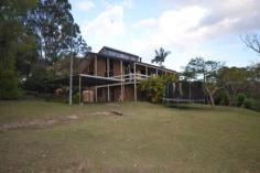  472 Veresdale Scrub School Rd Veresdale Scrub QLD 4285 $550,000 Negotiable WIDE OPEN SPACES AND LOADS OF ROOM WITHIN 5 BEAUTIFUL ACRES. Ideal property for those seeking peaceful living with country views. This outstanding offering to market features an elevated block with a contemporary style home. Designed to maximise the benefits of the property this home includes an Open Plan Living with sunken lounge and cathedral ceilings.The kitchen is fully functional with Freestanding Stainless Steel Cooker, dishwasher and breakfast bench. A sunken lounge takes advantage of the views to the country surrounds and hills beyond with access to the front veranda. The home boasts four bedrooms all with built-in robes, each bedroom is substantial in size with an ensuite and walk-in robe to the Master. Downstairs another living area provides room for children or an additional study area with a large storage room behind. Outdoor entertaining is easily accommodated with paved patio - BBQ area and above ground Pool. A fully self-contained Granny Flat gives living options for visiting relatives or grown up children desiring some privacy. The property includes a 12 x 6m Colourbond Shed for machinery, cars or storage..Complete with two paddocks and plenty of room for pets and children, this property offers a lifestyle choice not readily available to many.   Above Ground Pool, Balcony, Broadband, Built In Robes, Courtyard, Deck, Dishwasher, Ensuite, Floorboards, Fully Fenced, Grey Water System, Open Spaces, Outdoor Entertaining, Pay TV, Rumpus Room, Secure Parking, Shed, Solar Hot Water, Split System AirCon, Water Tank, Workshop, PROPERTY DETAILS Price $550,000 Negotiable Property Type House Property ID 2950411 4 2 5 
