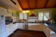  44 Duncan St Canungra QLD 4275  $475000 'BIRDS EYE VIEW, GREAT LOCATION" Elevated four bedroom home all with built in robes, on a large 1300m2 block only a 2minute walk from the centre of town, which is a comfortable 15 minute drive to the Pacific Hwy at Nerang. This Tri Level home has some great features including Australian Jarrah Timber floors, open plan kitchen, lounge, dining room with Cathedral ceilings and access to Veranda and entertainment area.  Lovely Cool Salt Chlorinated swimming pool, double garage, with exceptional views of the Ranges. This is a rare opportunity to acquire a property in this location and is a must to inspect.   Balcony, Broadband, Built In Robes, Dishwasher, Floorboards, Fully Fenced, In Ground Pool, Outdoor Entertaining, Pay TV, Secure Parking, Shed, PROPERTY DETAILS Price Offers Over $475000 Property Type House Land Size 1300 M2 Property ID 2963779 4 1 2 