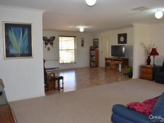  12 Farrer St Parkes NSW 2870 $365,000 SPACIOUS FAMILY LIVING! You'll get an instant welcoming feel when you enter this open planned four(4) bedroom brick veneer home. Just a decade young, this fresh modern home boasts a laid back, stress free lifestyle.  - Main bedroom has walk-in robe & en-suite with built-in robes in the other three.  - Generous open plan kitchen/dining/living zone  - Immaculate family bathroom  - Double lock-up garage with internal access via laundry  - Ducted evaporative a/c & natural gas heating  - Elegant covered entertaining area  - Manicured established gardens & secure backyard  All you need to do is unpack, relax and enjoy!  For more details or to arrange your inspection, contact our eager Sales Team. ID: 349283 Council Rates: $1,863.09 Land Area: 720 m² Zoning: R1 
